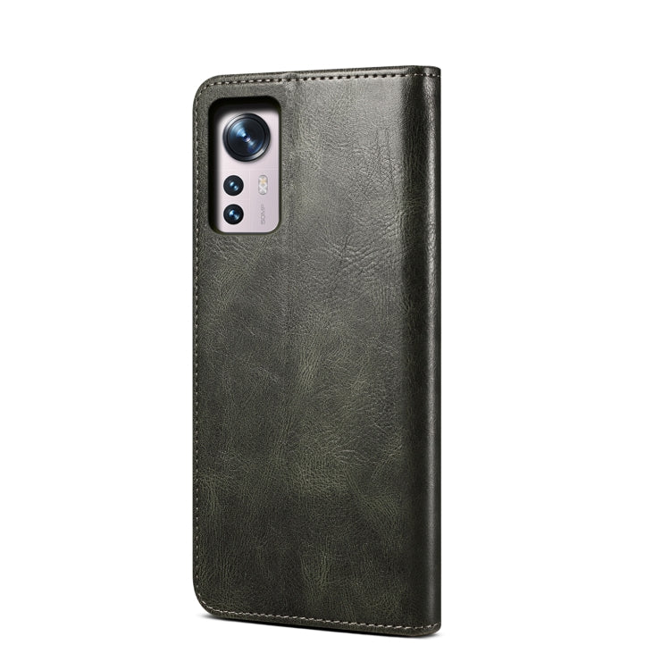 Dark green leather phone case with camera cutouts and stitched border