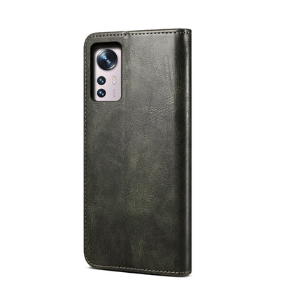 Dark green leather phone case with camera cutouts and stitched border
