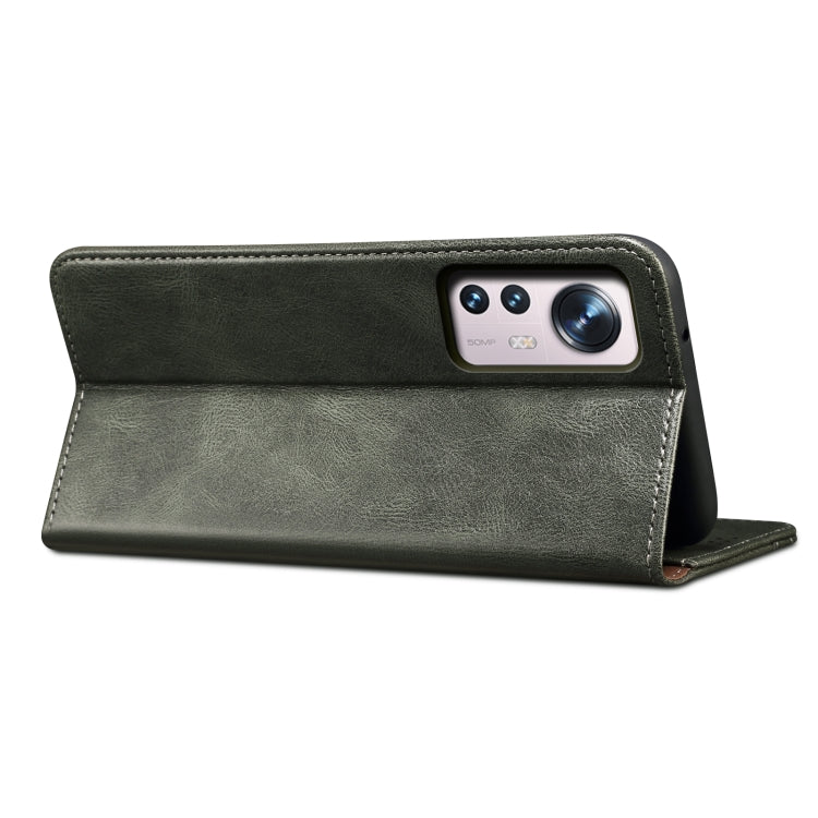 Dark green leather wallet-style phone case with camera cutout flap
