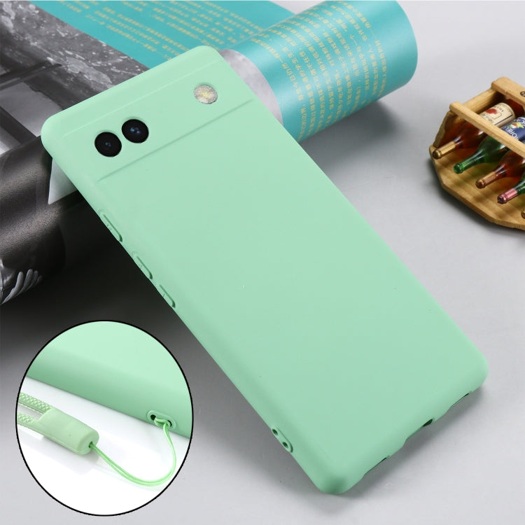 Mint green silicone phone case for Pixel 6a, angled back view