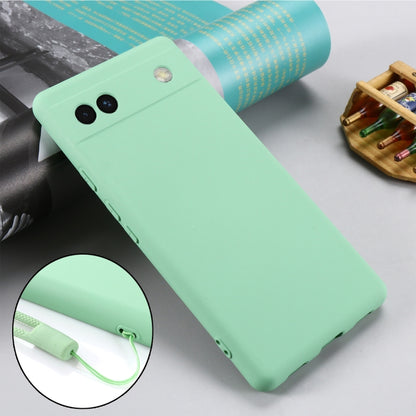 Mint green silicone phone case for Pixel 6a, angled back view