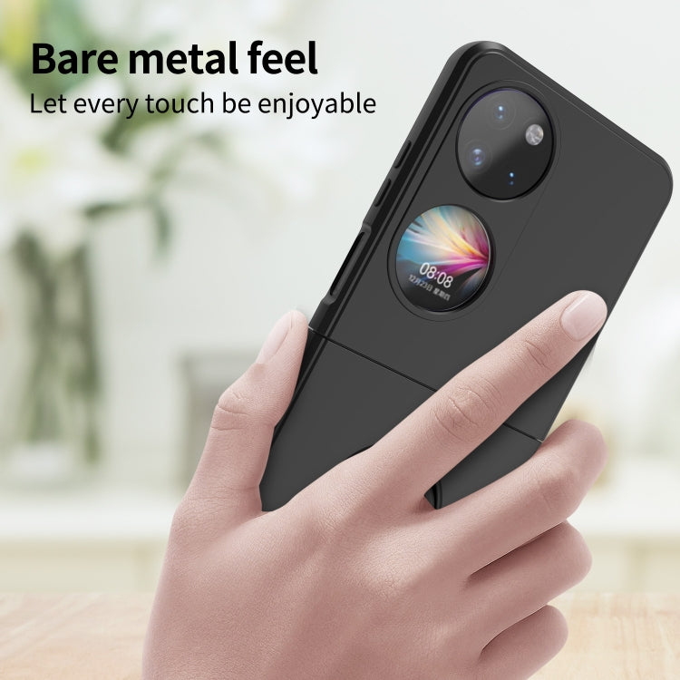 Black smartphone ring holder phone case held in hand, showing circular ring grip