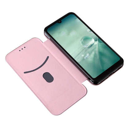 Pink carbon fiber texture flip phone case with smile face design on back cover.
