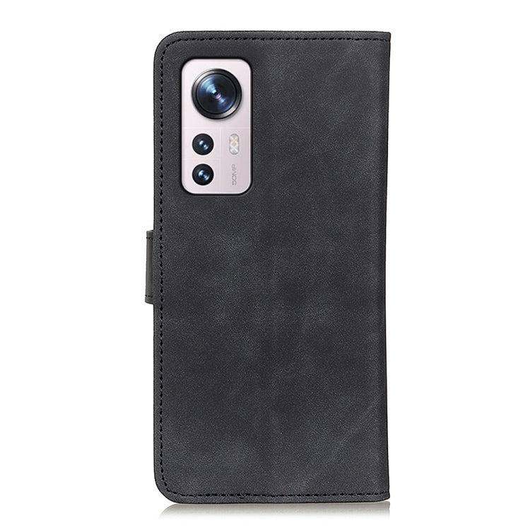 Black KHAZNEH leather phone wallet case with camera cutout.
