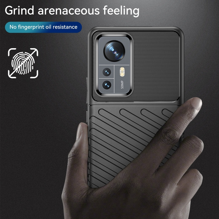 Black TPU phone case with ridged back and camera window for shock protection