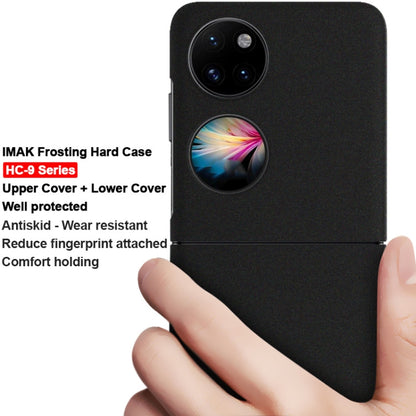 Black frosted hard phone case for Huawei P50 Pocket held in hand, camera opening visible