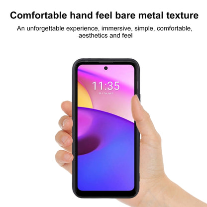 Black TPU phone case held in hand, showing camera and charging cutouts