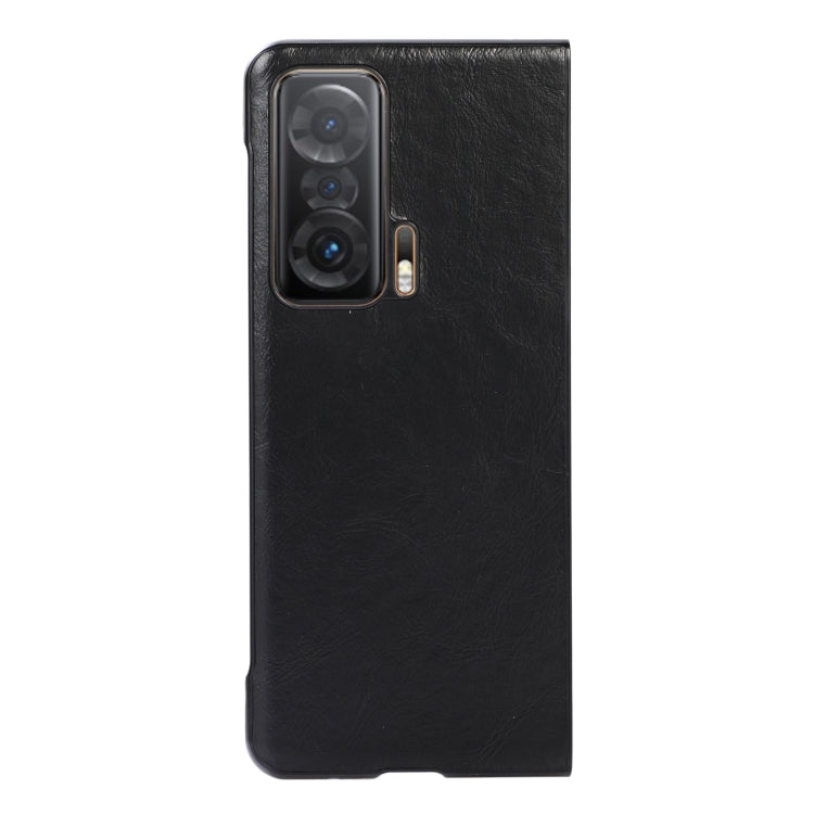 Black leather protective phone case back with triple camera cutouts and side slot