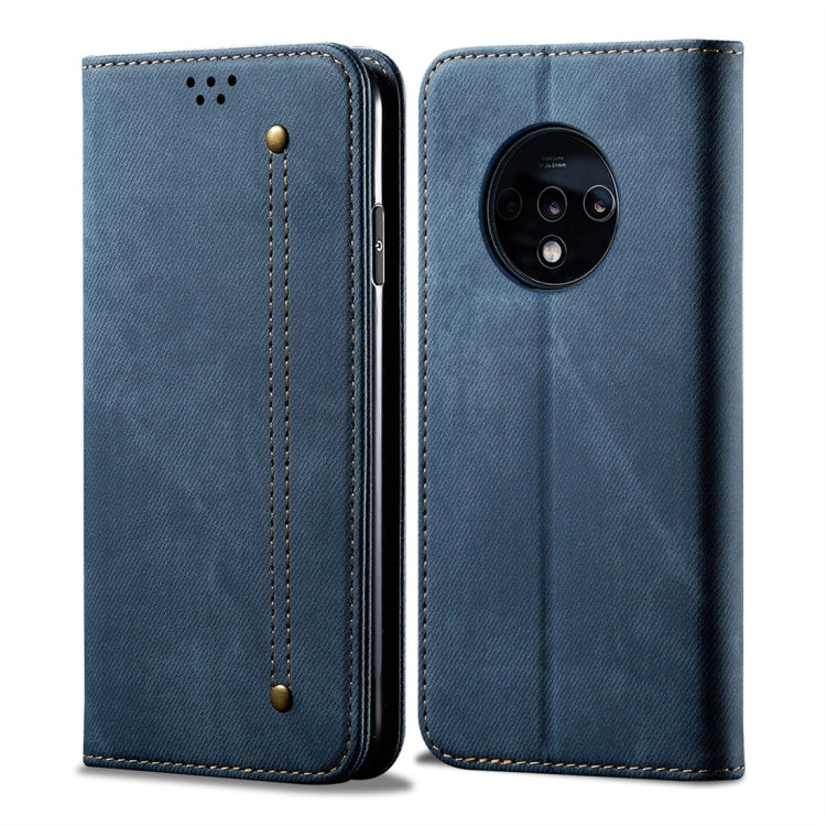 Blue denim-textured leather flip phone case with stitched panels and camera opening