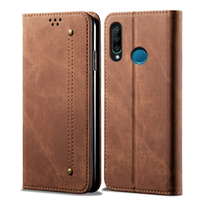 Brown denim-textured leather flip phone case with key-ring style hole and camera cutout