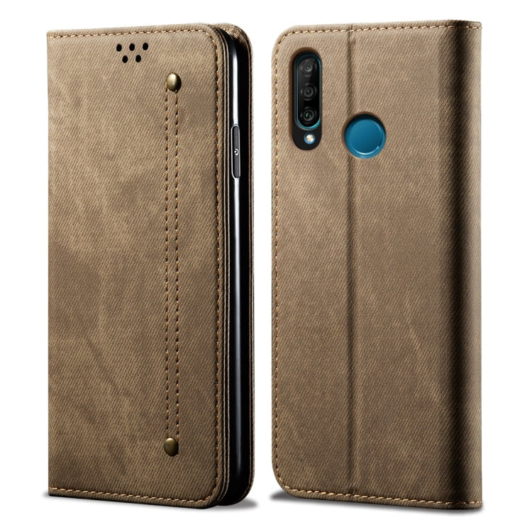 Khaki denim-textured leather flip phone case with teal camera button and camera opening