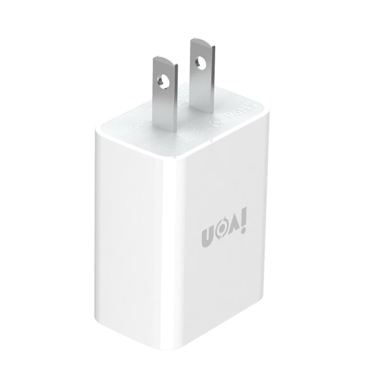 White USB travel charger with two-prong plug, compact cube design.
