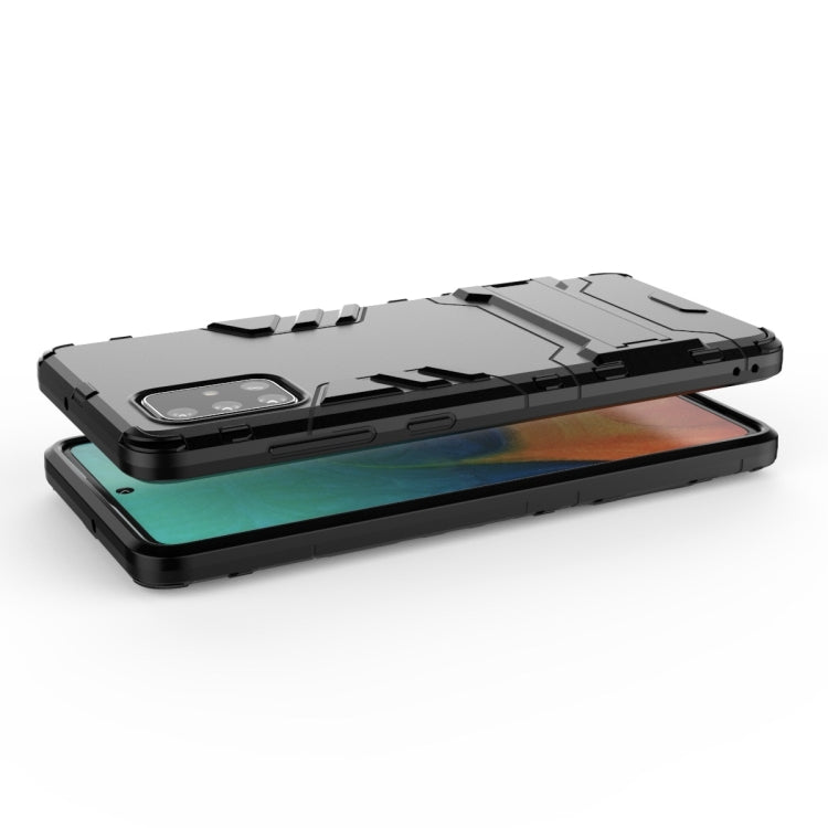 Black shockproof phone case with screen-protective raised edges and camera cutout