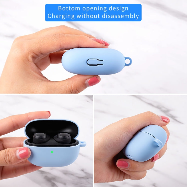Light blue silicone earbud protective case with hook, earbuds inside, lid closed