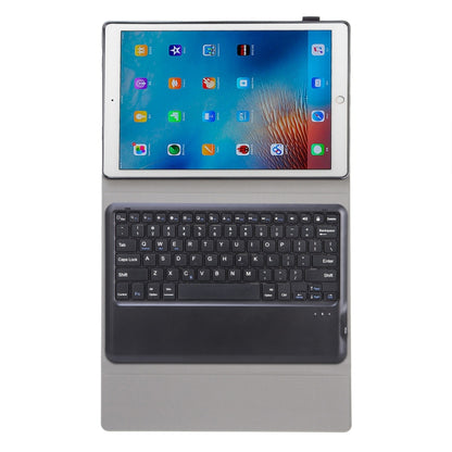 Dark gray tablet keyboard case with folio cover, laptop-style open view