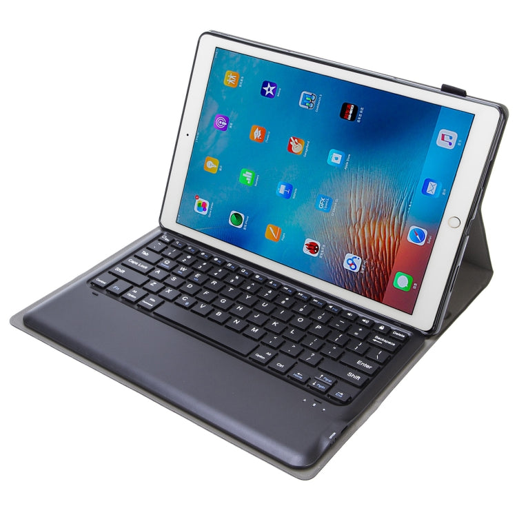 Dark gray detachable keyboard tablet case with stand, front angled view