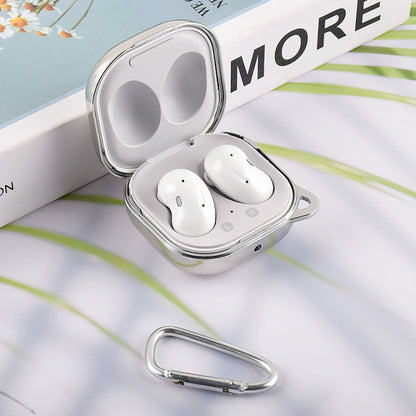 Silver earphone protective case open with white wireless earbuds and carabiner