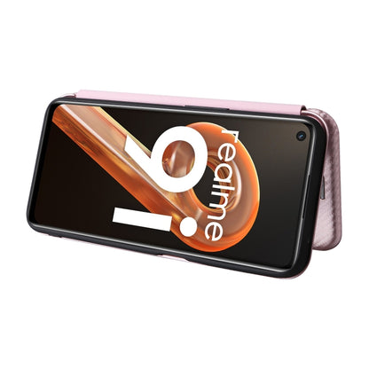 Pink magnetic flip phone case on phone with carbon fiber textured edges