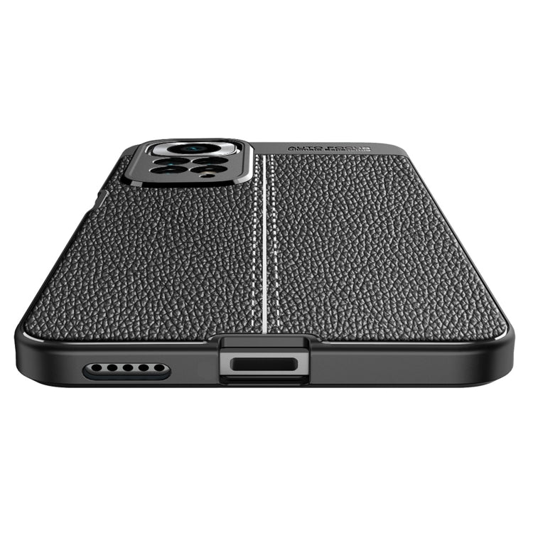 Black litchi-textured phone case with speaker port opening and protective screen lip