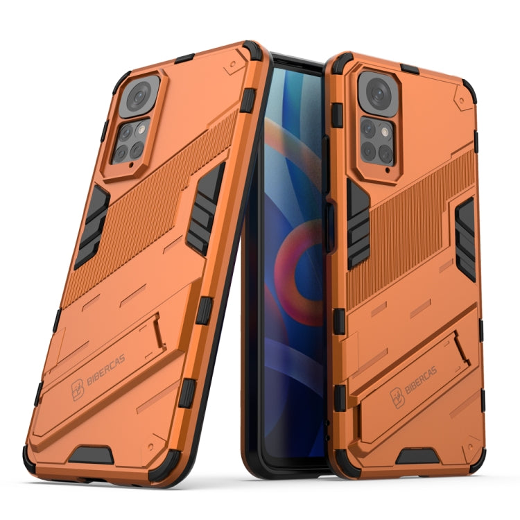 Rugged orange phone case with raised corners and camera cutouts