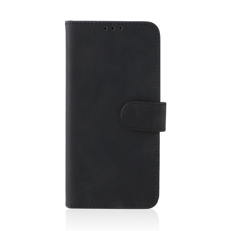 Black leather folio phone case with magnetic clasp and stitched edges, back view