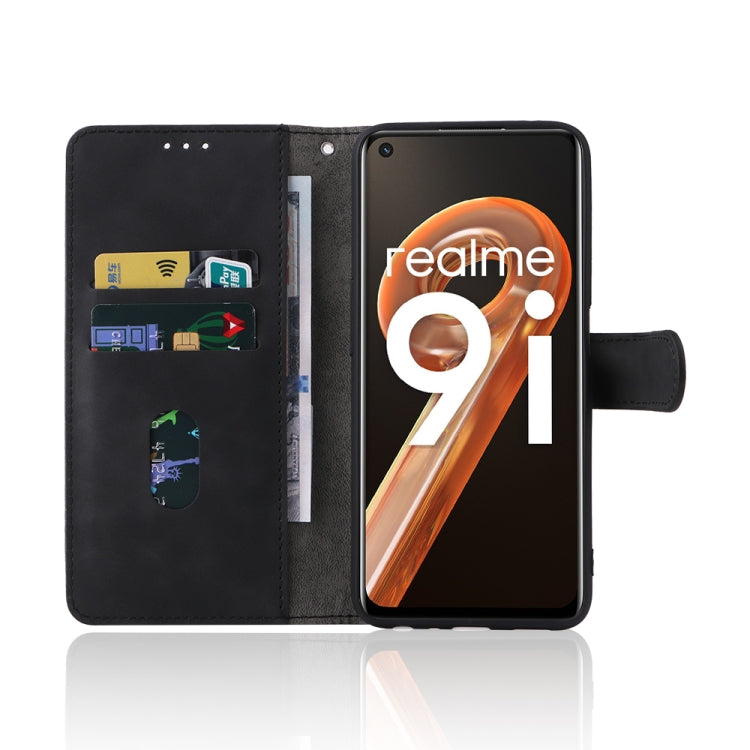Black leather folio phone case with magnetic buckle, card slots, and side camera opening