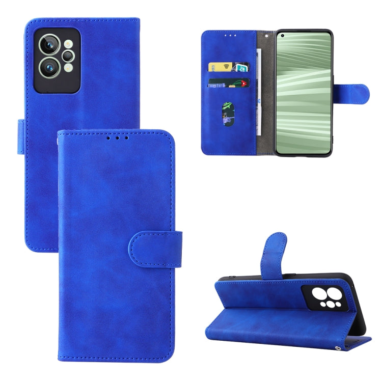 Blue leather folio phone case with magnetic buckle, camera cutout, and stand cover