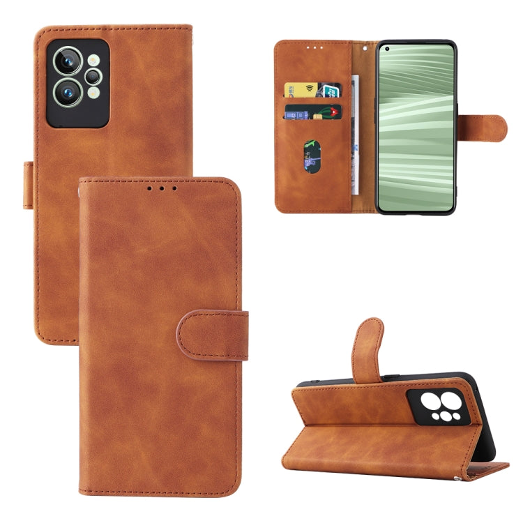 Tan/brown leather folio phone case with magnetic buckle, camera cutout, and kickstand