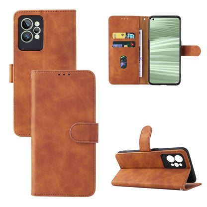 Tan/brown leather folio phone case with magnetic buckle, camera cutout, and kickstand
