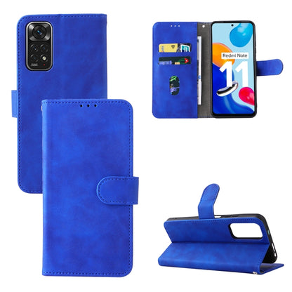 Bright blue leather folio phone case with magnetic buckle, camera cutout, and stand