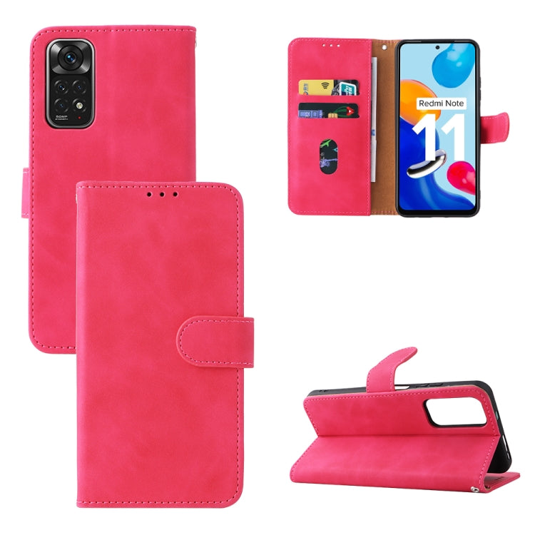 Pink leather folio phone case with magnetic buckle, camera cutout, and flip stand