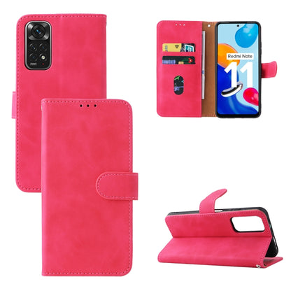 Pink leather folio phone case with magnetic buckle, camera cutout, and flip stand