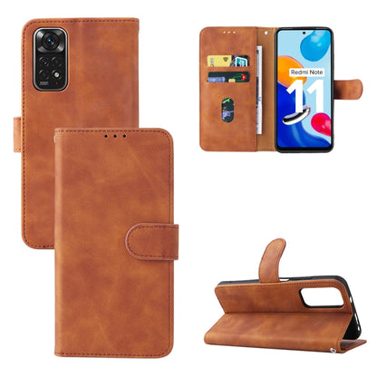 Brown leather magnetic buckle phone case with folio flap and card slots, stand view