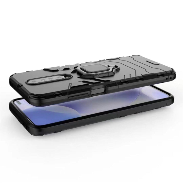 Rugged black phone case with magnetic ring holder, shockproof shell, worn on a phone