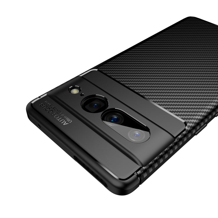 Black carbon fiber TPU phone case close-up of camera openings and textured back panel.