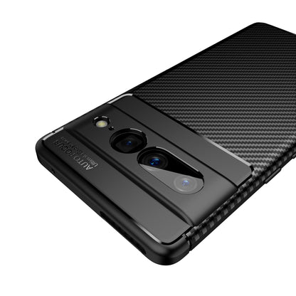 Black carbon fiber TPU phone case close-up of camera openings and textured back panel.
