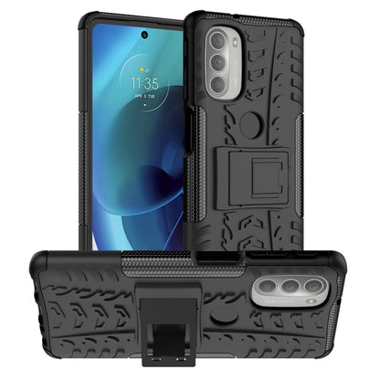 Rugged black phone case with tire tread texture and built-in kickstand holder