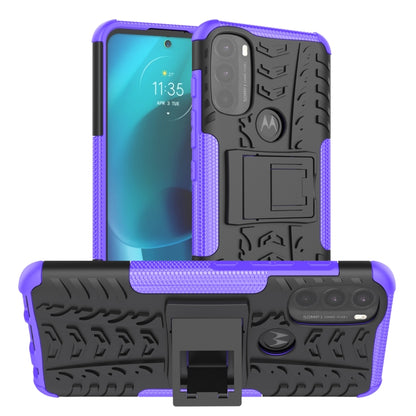 Rugged purple phone case with tire tread texture and built-in kickstand holder