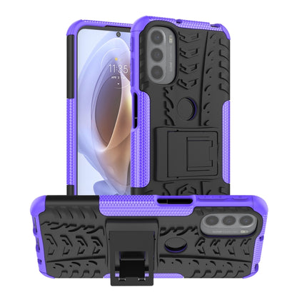 Rugged purple and black phone case with tire tread texture and kickstand holder