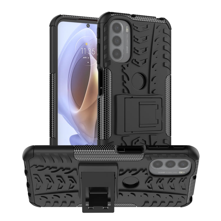 Rugged black phone case with tire tread texture and built-in kickstand holder
