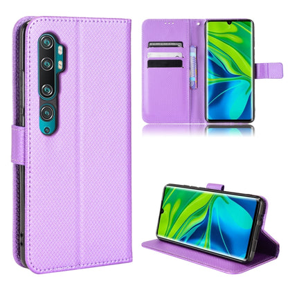 Purple diamond-textured leather flip case with vertical camera cutout, kickstand