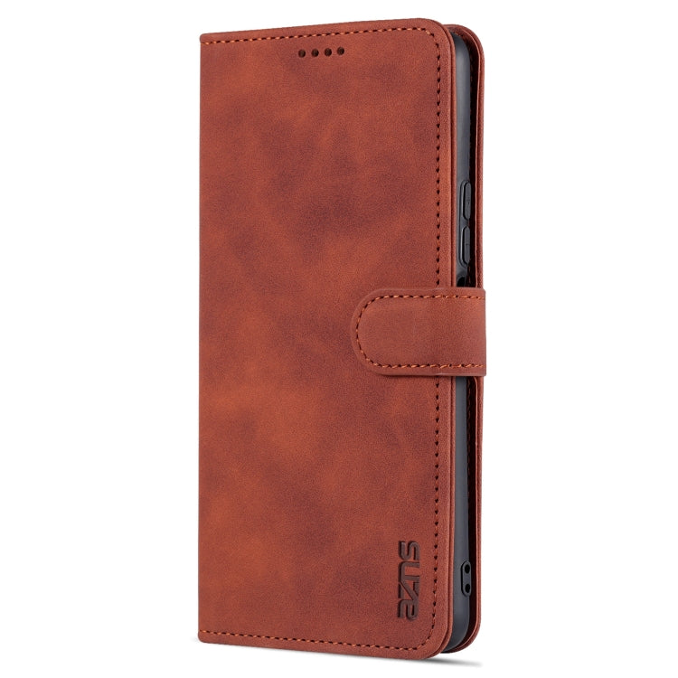 Brown textured leather flip phone case with side camera cutout and stitched wallet flap