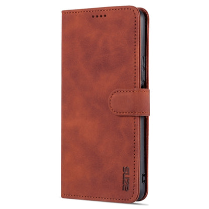 Brown textured leather flip phone case with side camera cutout and stitched wallet flap