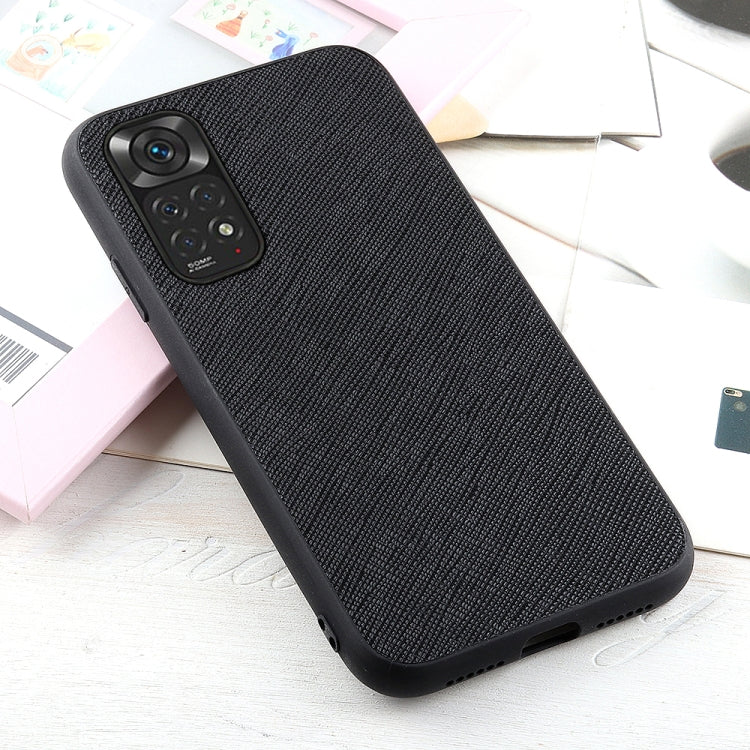 Black textured leather shockproof phone case, angled view showing camera area