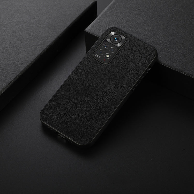 Black litchi-texture phone case with raised camera bump and cutouts