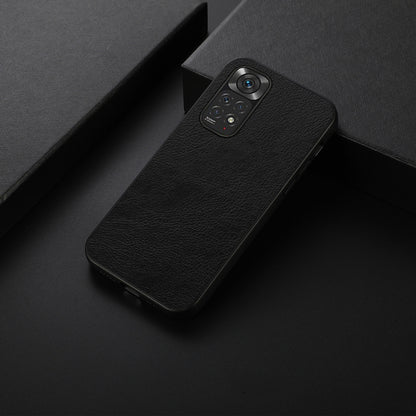 Black litchi-texture phone case with raised camera bump and cutouts