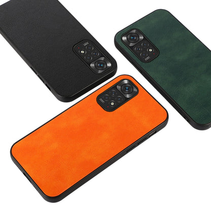 Three litchi-texture phone cases: black, orange, and green with camera cutouts