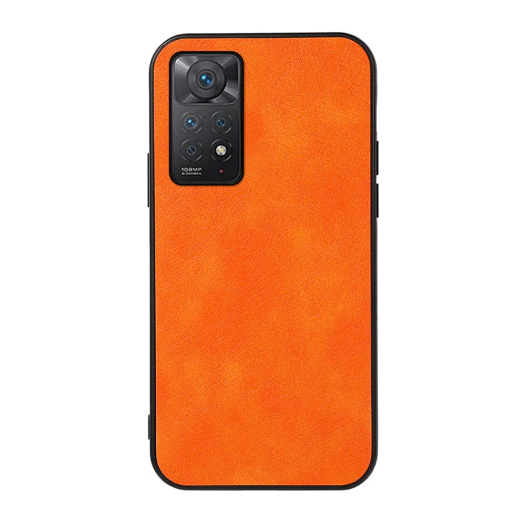 Orange litchi-texture phone case with raised camera module and cutouts