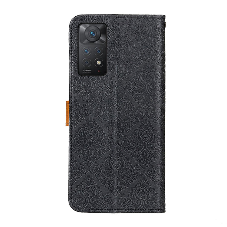 Black embossed leather phone case with camera cutout and tan strap