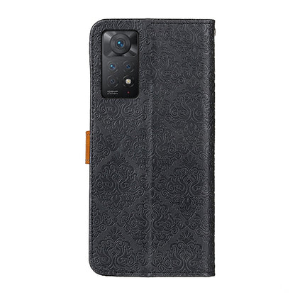 Black embossed leather phone case with camera cutout and tan strap